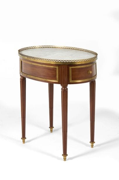 Small 
oval-shaped table made of mahogany...