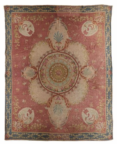 Large Aubusson rug
with a wine-red background...
