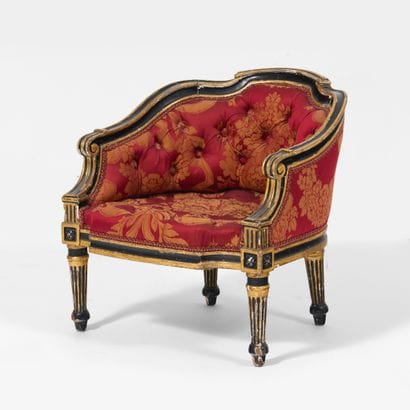 Footstool 
with a curved shape, made of black...