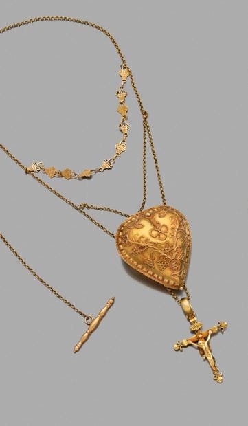 Coulant 
en forme de cœur en or 18K (750),...