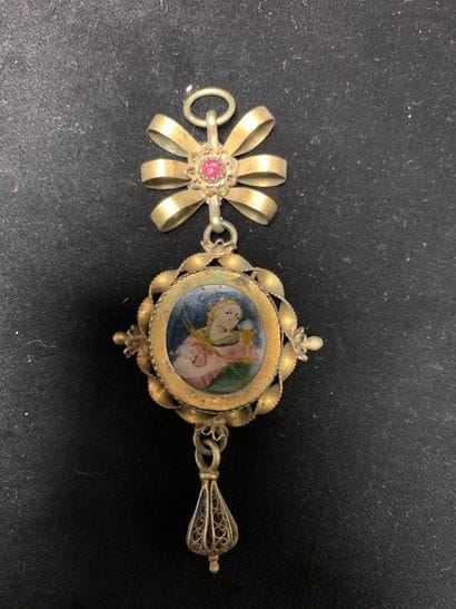 Deux pendentifs
en argent et argent doré....