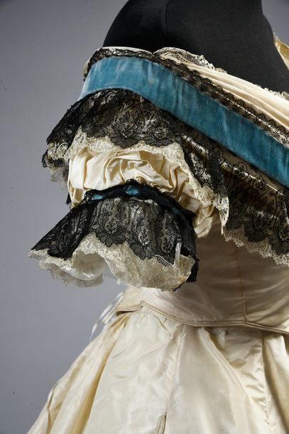 Ball gown, circa 1865, dress in cream silk...