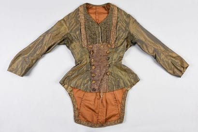 Daytime dress, circa 1885, in green striped...