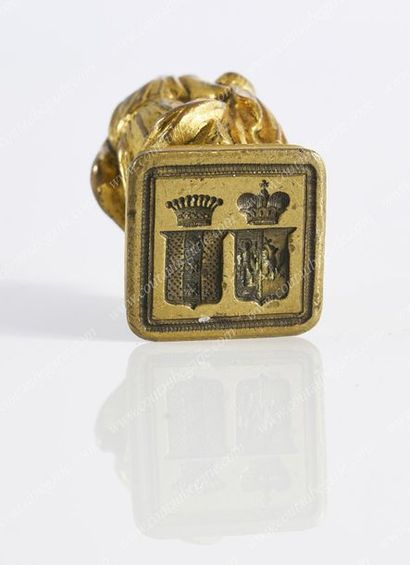 CACHET À CIRE.
En bronze doré, sculpté d'une...