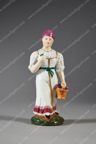 FIGURINE EN PORCELAINE POLYCHROME.
Représentant...
