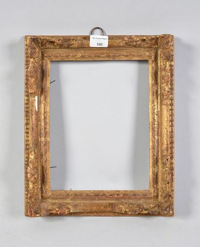 Sculpted and gilded oak frame with corner...