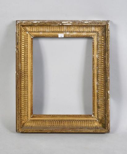 Sculpted and gilded oak frame decorated with...