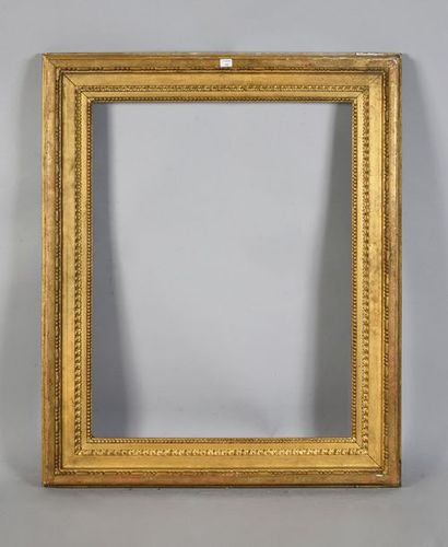 Carved and gilded oak frame decorated with...
