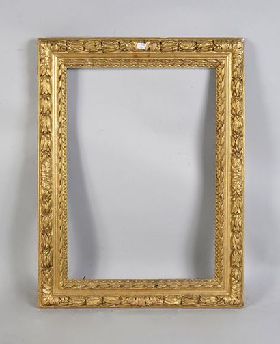 Carved and gilded wooden frame decorated...