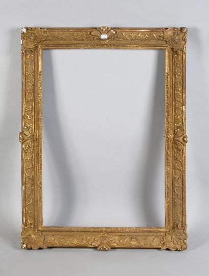 Carved and gilded oak frame with Bérain decoration.

Louis...