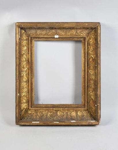 Wood and gilded paste frame with a large...