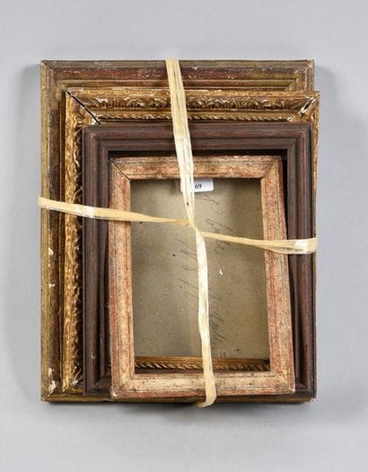 Set of four small carved wooden frames, one...