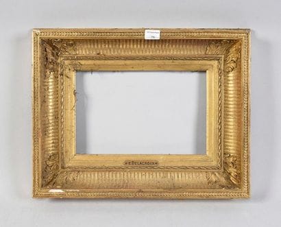 Wooden frame and gilded stucco called 