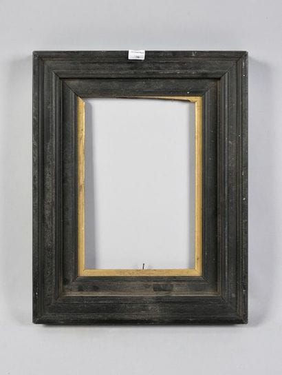 Moulded and blackened wood frame with gold...