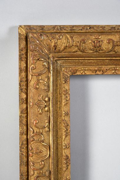 Carved and gilded oak frame with Bérain decoration.

Louis...