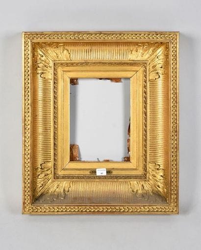 Wooden frame and gilded stucco called 