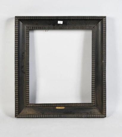Blackened wooden frame decorated with guilloche...