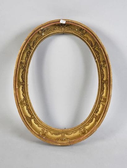 Oval frame in wood and gilded paste with...