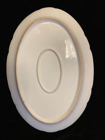 LARGE DECORATIVE DISH. 
 In porcelain, oval...