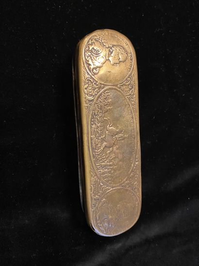 LARGE TABATIERE.
In gilt brass, oval shape,...