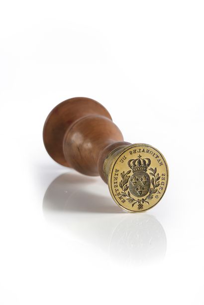 Wax seal.
Engraved in the center of the coat...