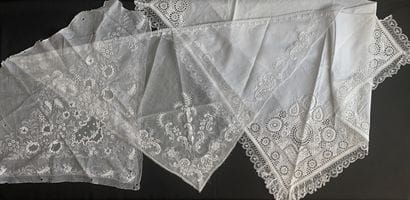 Two white embroidery fichus, 19th century....