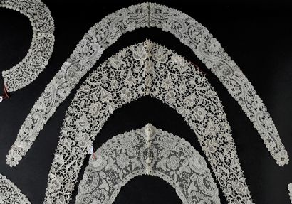 Seven lace collars, needlepoint and bobbins,...