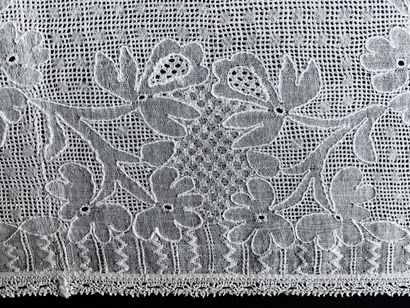 A border in drawn and embroidered threads,...