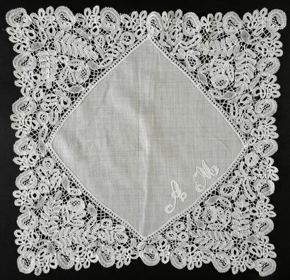 Four Honiton lace handkerchiefs, spindles,...