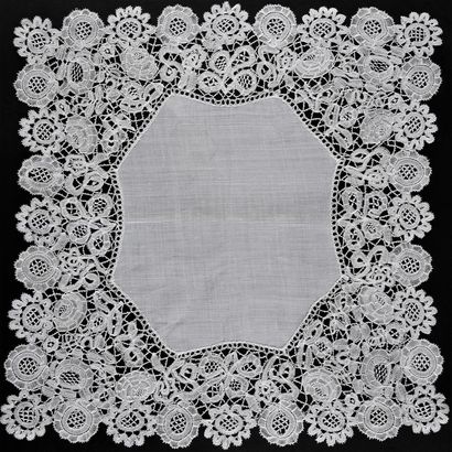 Four Honiton lace handkerchiefs, spindles,...