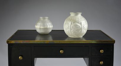 A pair of pressed moulded glass globular...