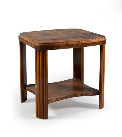 Low table in rosewood veneer, it rests on...
