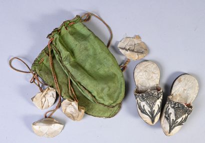 Rare pair of miniature shoes, first third...