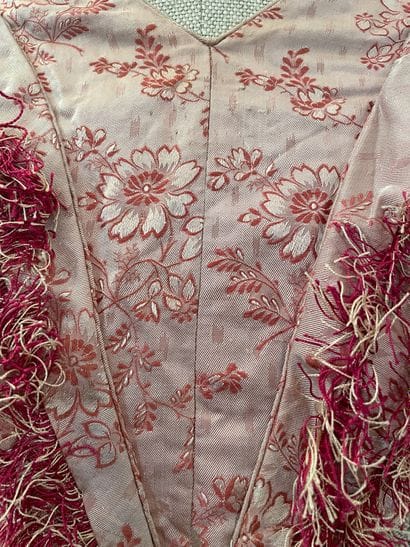 Meeting of elements of dresses in silks,...