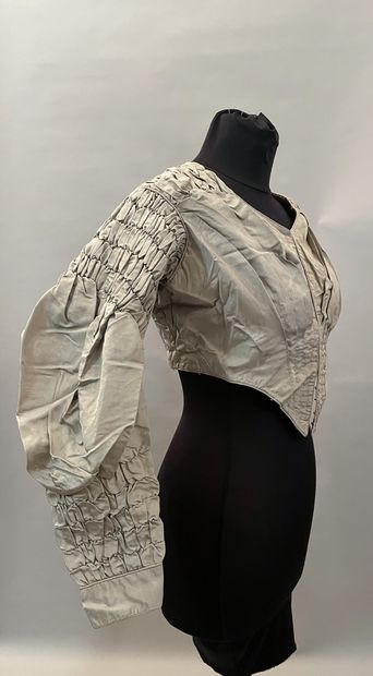 Meeting of elements of dresses in silks,...