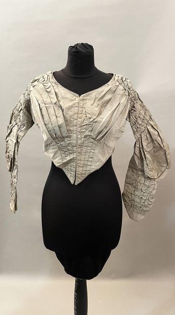 Meeting of elements of dresses in silks,...