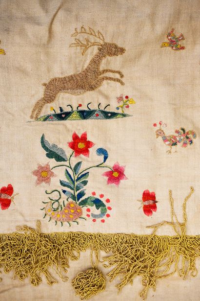 Embroidered valance, mounted as a wall hanging,...