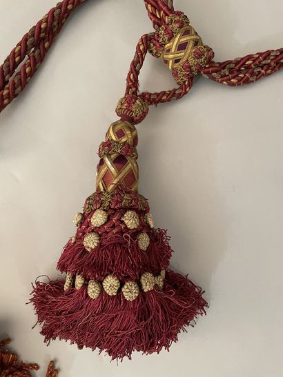 Three sets of cabled tassel tiebacks, two...
