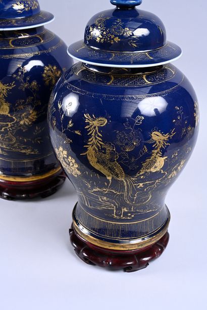 Two large covered vases in powder blue porcelain....