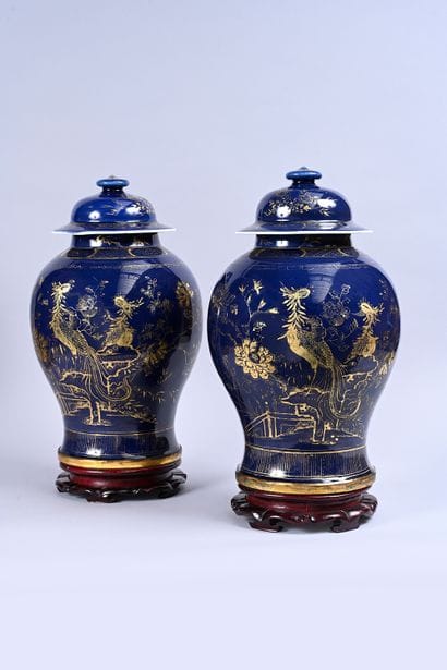 Two large covered vases in powder blue porcelain....