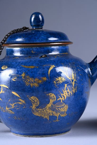 Two powder blue porcelain teapots with ducks....