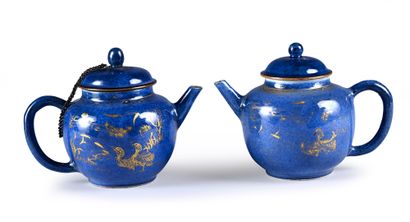 Two powder blue porcelain teapots with ducks....