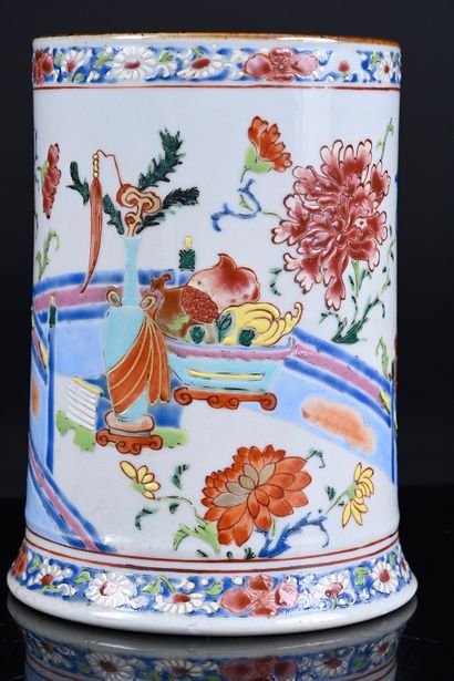 Porcelain tankard decorated in famille rose...