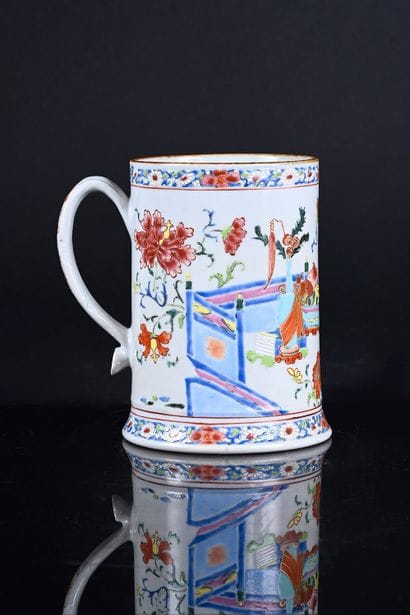 Porcelain tankard decorated in famille rose...