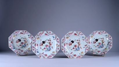 Four plates decorated in famille rose enamels....