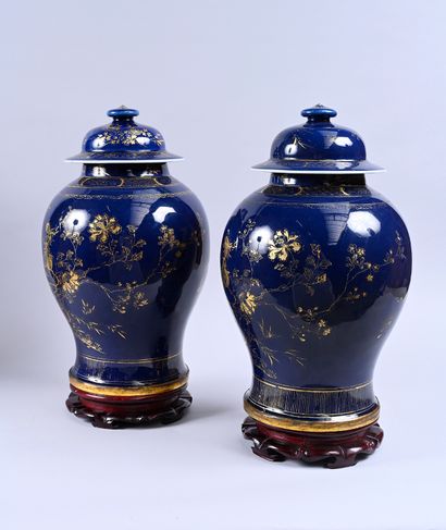 Two large covered vases in powder blue porcelain....