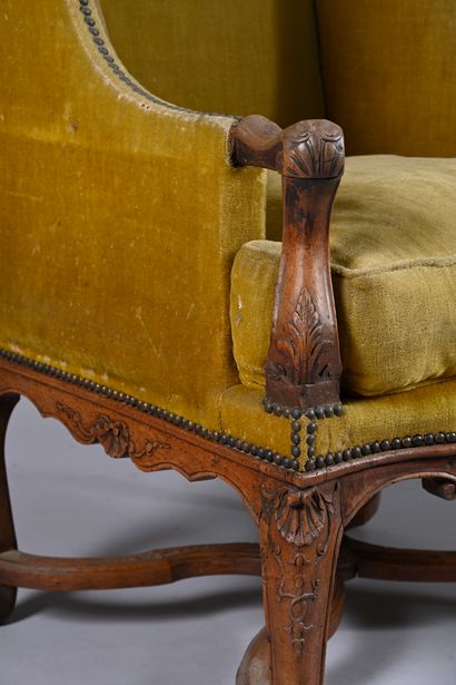 Large natural walnut wing chair, 
carved...