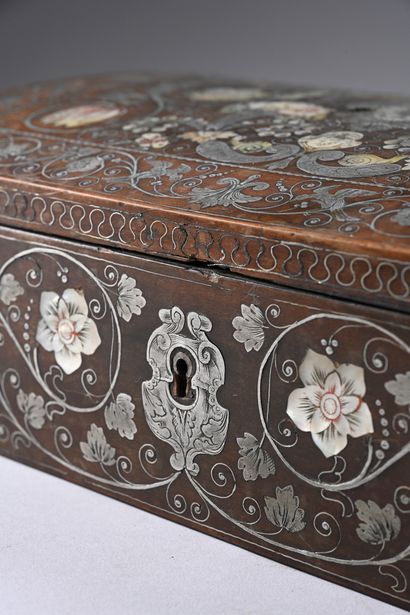 Wooden case inlaid with silver and mother-of-pearl....