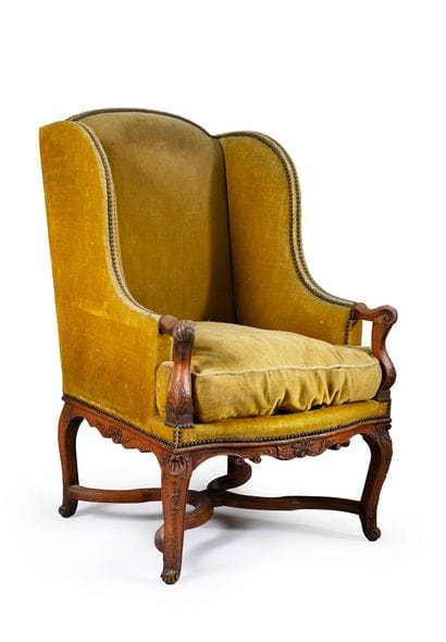 Large natural walnut wing chair, 
carved...