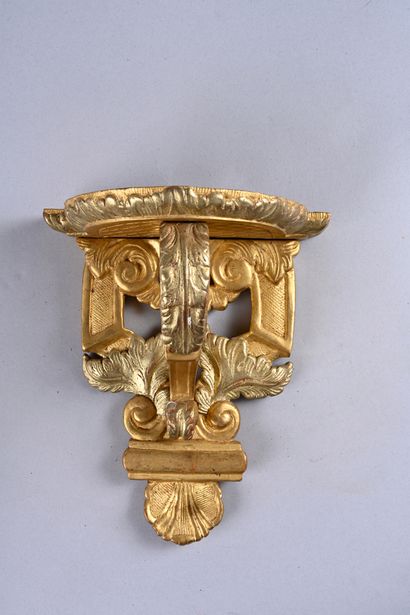 Pair of wall brackets in molded wood, 
carved...